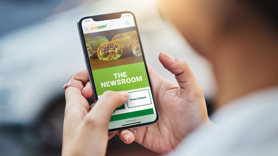 Smartphone displaying a website titled “The Newsroom.”