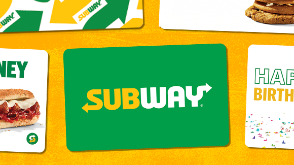 Subway® gift cards lying flat on a yellow surface.