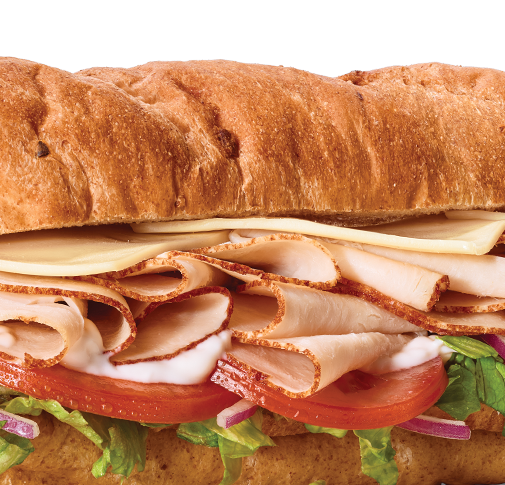 Closeup of an Oven-Roasted Turkey sub. Any Footlong for $6.99.